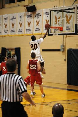 Mark McNee (20) made eight out of ten free throws and five field goals while leading his team to victory over the Falcons.