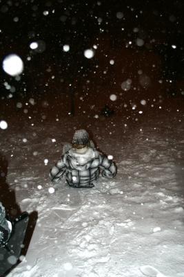 A residence student braves the cold to tray-boggan near the S Building on North Campus. A residence student braves the cold to tray-boggan near the S Building on North Campus.