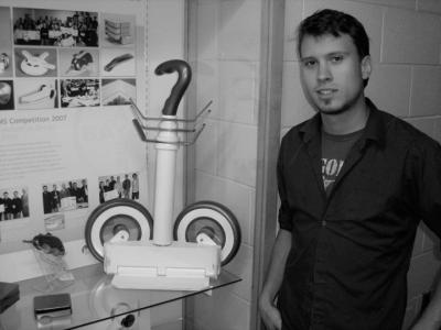 Phillip Savignac shows a collapsible shopping cart from last year.