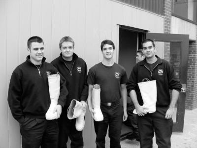 Fire and emergency services students collect funds for breast cancer with pink boots in tow.