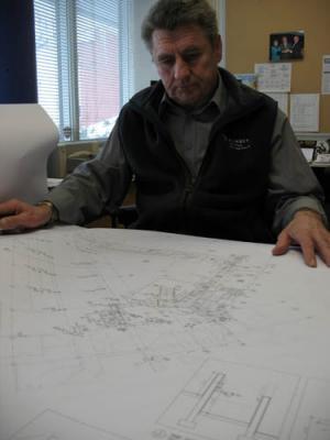 Construction manager Richard Baruk reviews plans for the North Campus Student Centre